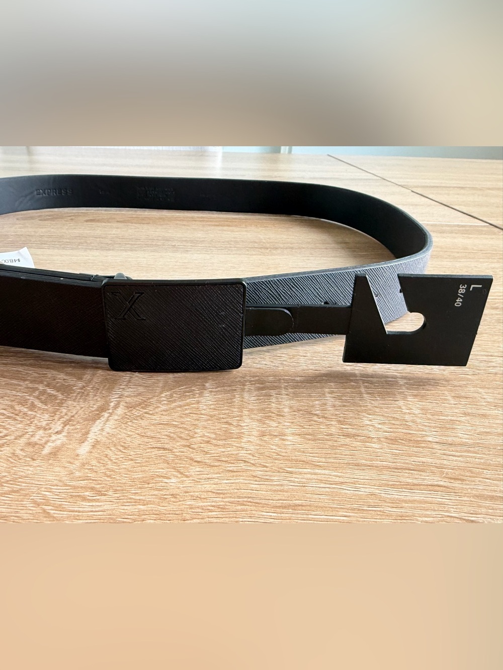 NEW with TagExpress black leather belt with textured buckle, size 38/40